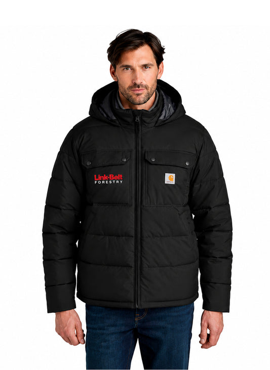 A man wearing a black hooded puffer jacket with a front zipper, two flap chest pockets, and visible Carhartt and Forest River logos, paired with blue jeans against a plain white background.