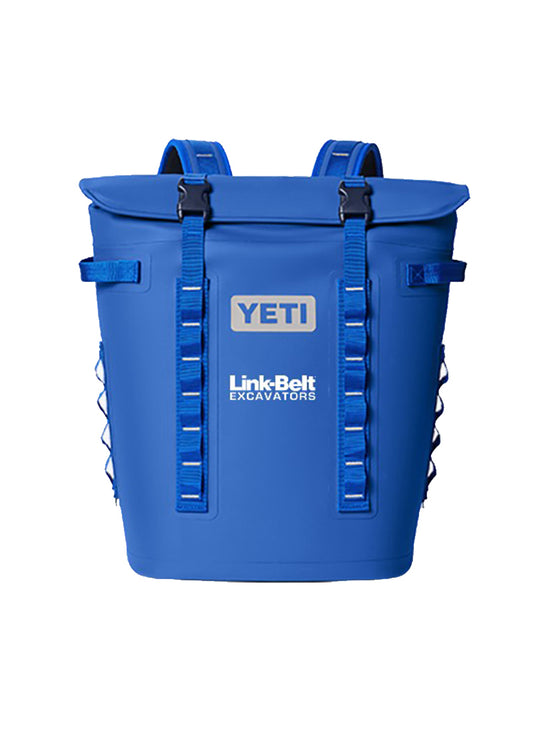 A blue YETI Link Belt Excavators cooler bag with front straps and buckles, shown against a plain white background.