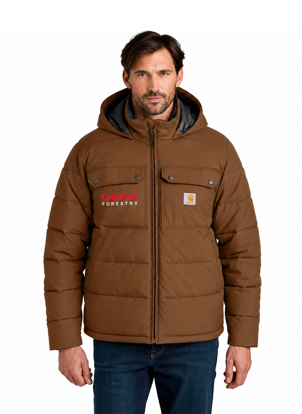 A man wearing a brown hooded puffer jacket with a black-lined hood, front zipper, and two chest pockets. The jacket has a Carhartt logo patch on the right chest and a Carhartt Forestry logo on the left chest.