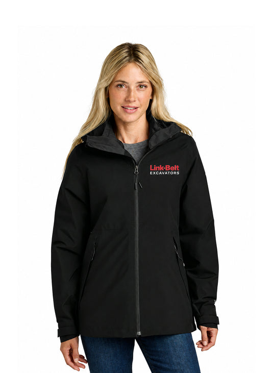 A woman wearing a black hooded jacket with a red and white 'Link-Belt EXCAVATORS' logo on the left chest, paired with blue jeans, against a plain white background.