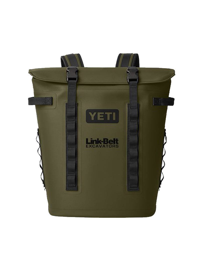An olive green YETI backpack-style cooler with black straps and buckles, featuring the YETI and Link Belt Excavators logos on the front, set against a plain white background.